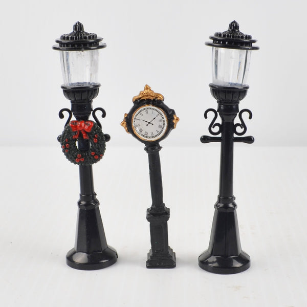 Lot of 17 Holiday Time Christmas Village Trees Figures Lamp People Santa Clock